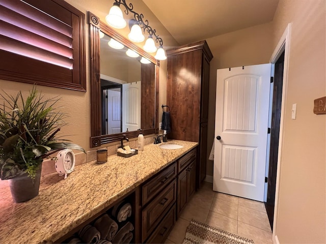 bathroom with tile patterned flooring and vanity