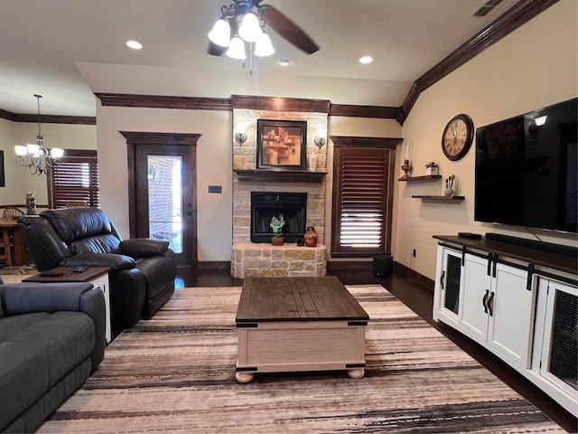 living room featuring recessed lighting, a fireplace, baseboards, ornamental molding, and dark wood finished floors