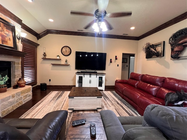 living area with ornamental molding, visible vents, baseboards, and wood finished floors