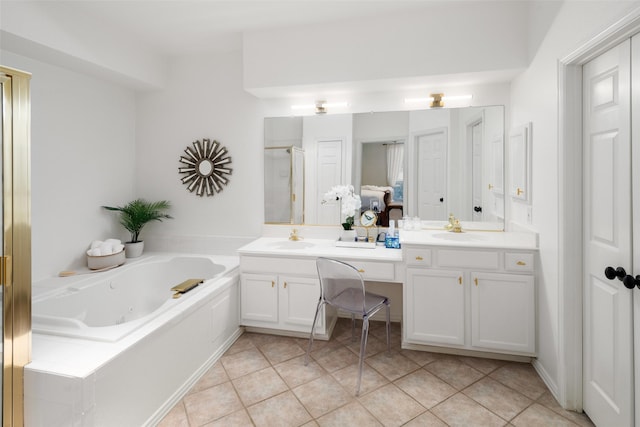 bathroom with double vanity, a tub with jets, a stall shower, and a sink