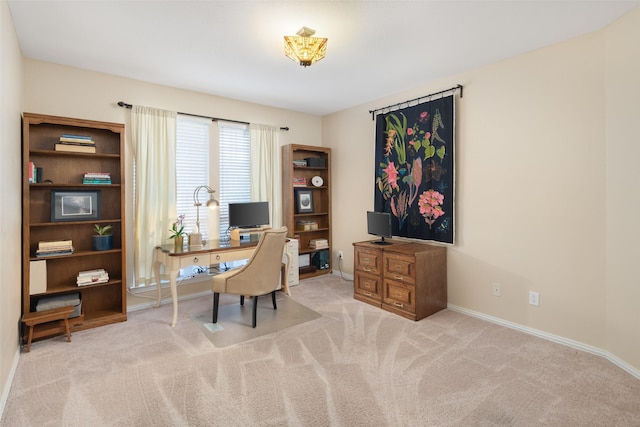 carpeted office with baseboards