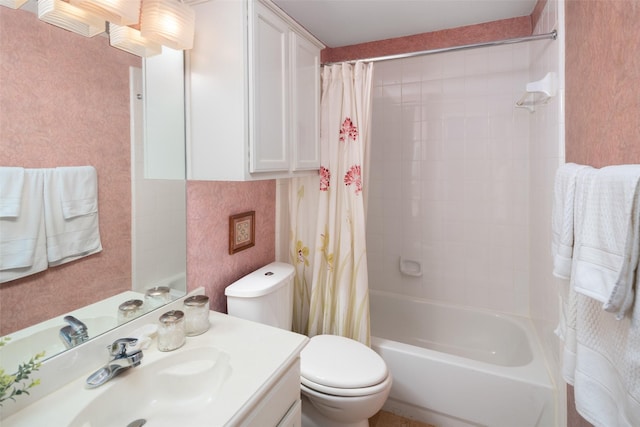 bathroom with shower / bath combo, vanity, and toilet