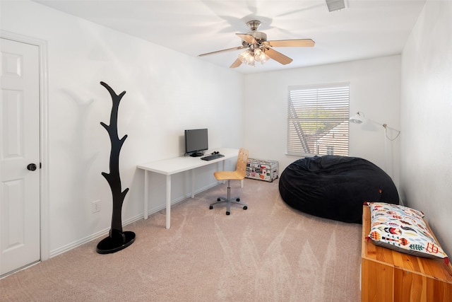 office space with visible vents, carpet, a ceiling fan, and baseboards