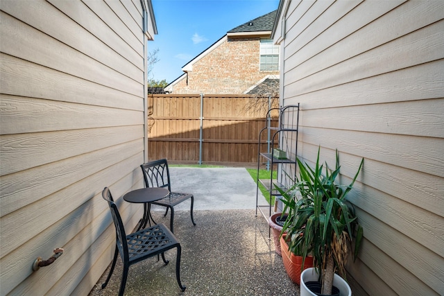 view of patio featuring fence