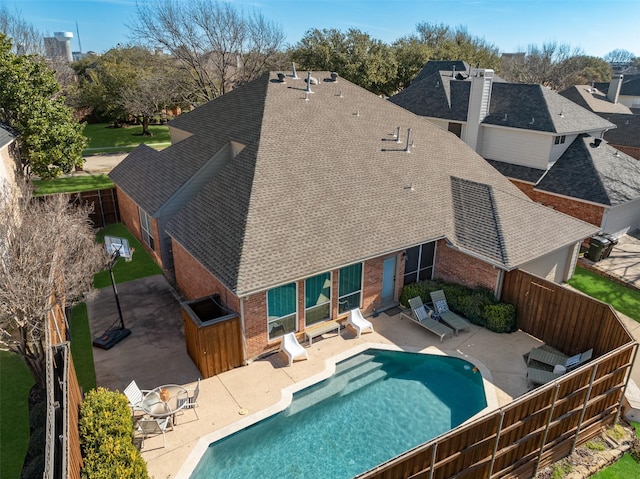 view of pool with a fenced in pool, a fenced backyard, and a patio