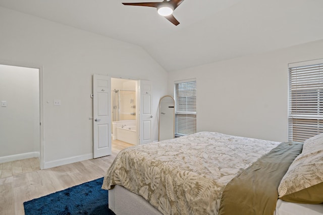 bedroom with light wood-style flooring, multiple windows, baseboards, and vaulted ceiling