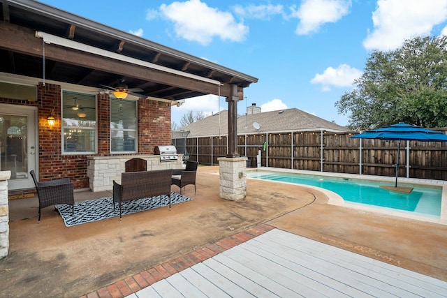 view of pool with a fenced in pool, a patio, area for grilling, a fenced backyard, and ceiling fan