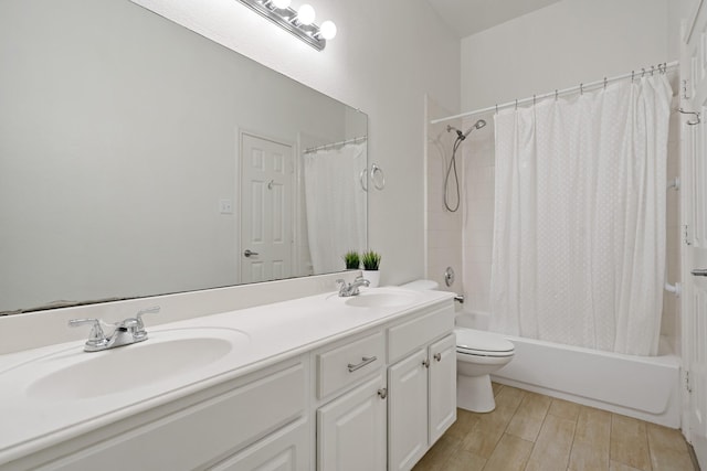 bathroom featuring double vanity, shower / bath combo, a sink, and wood tiled floor