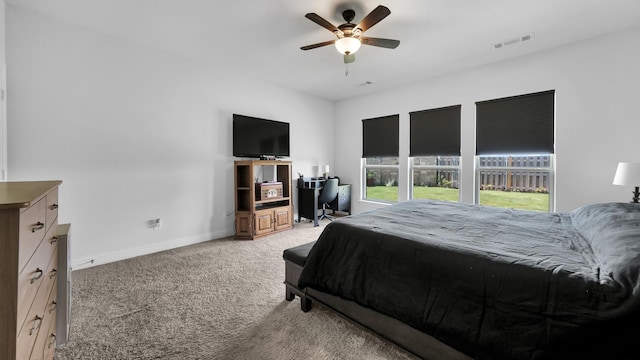 bedroom with light carpet, baseboards, visible vents, and ceiling fan