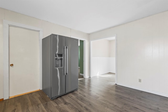 empty room featuring dark wood finished floors