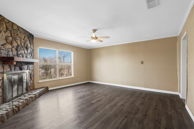 unfurnished living room with dark wood-style floors, visible vents, a stone fireplace, and baseboards