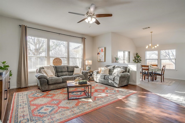 living area with visible vents, a healthy amount of sunlight, and wood finished floors