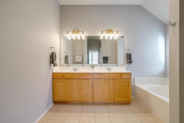 bathroom with tile patterned floors, vaulted ceiling, double vanity, and a sink