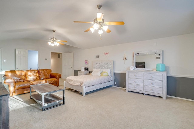 bedroom with light carpet, visible vents, ceiling fan, and lofted ceiling