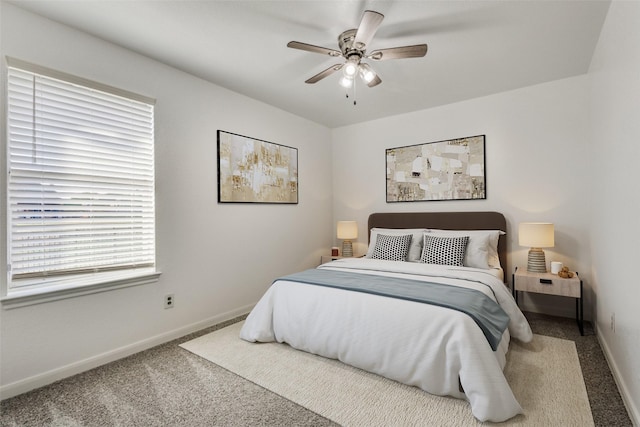 bedroom featuring ceiling fan, carpet, and baseboards