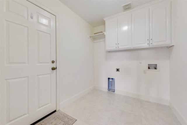 laundry area featuring washer hookup, visible vents, cabinet space, electric dryer hookup, and baseboards