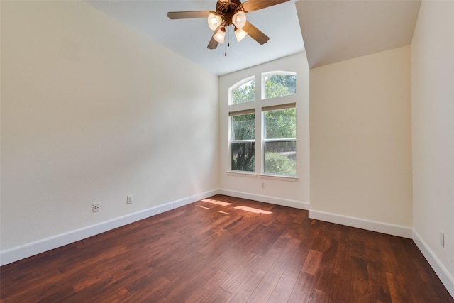 unfurnished room with ceiling fan, wood finished floors, and baseboards