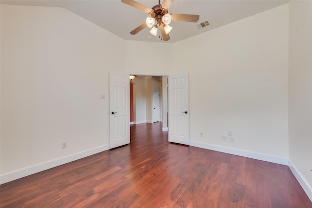 unfurnished room featuring lofted ceiling, visible vents, ceiling fan, wood finished floors, and baseboards