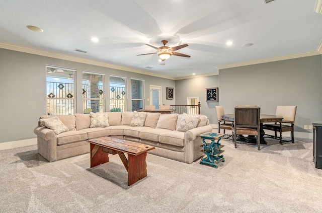 carpeted living area featuring baseboards, recessed lighting, a ceiling fan, crown molding, and visible vents