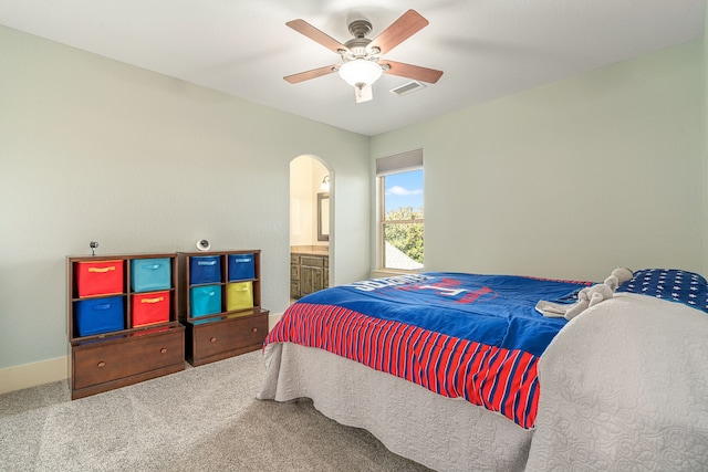 bedroom with visible vents, baseboards, arched walkways, a ceiling fan, and carpet floors