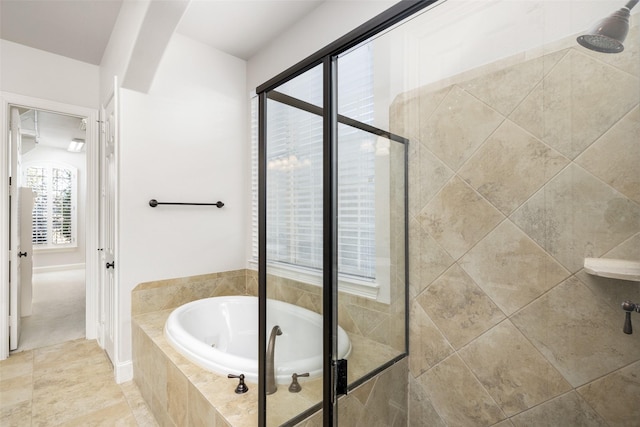 bathroom featuring a garden tub and a stall shower