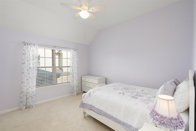 bedroom featuring ceiling fan, baseboards, lofted ceiling, and carpet