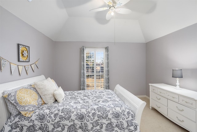 bedroom featuring a ceiling fan, lofted ceiling, light colored carpet, and baseboards