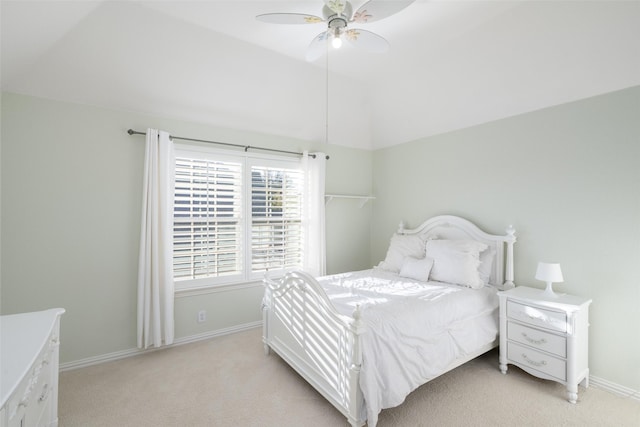 bedroom featuring lofted ceiling, light colored carpet, baseboards, and ceiling fan