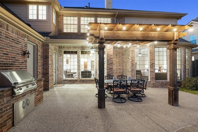 view of patio / terrace featuring area for grilling, an outdoor kitchen, and outdoor dining area