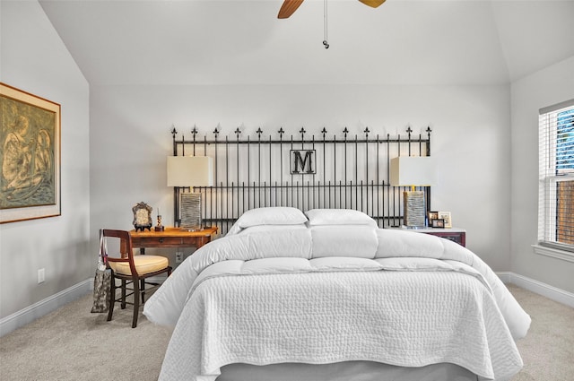 carpeted bedroom featuring vaulted ceiling, baseboards, and ceiling fan