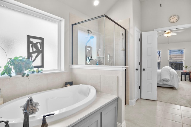 ensuite bathroom with a stall shower, ceiling fan, connected bathroom, tile patterned flooring, and a bath