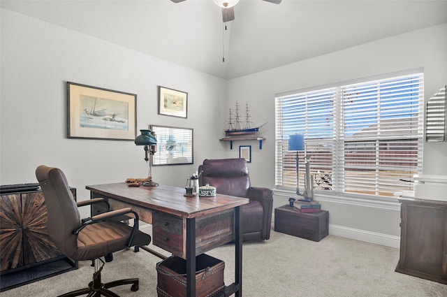 office featuring lofted ceiling, a ceiling fan, baseboards, and carpet flooring