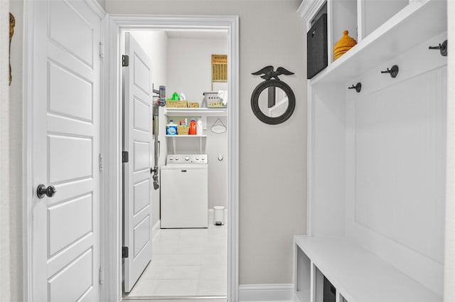 mudroom featuring washer / dryer and baseboards