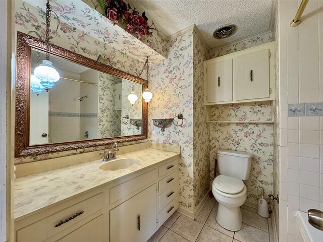 bathroom featuring visible vents, wallpapered walls, toilet, a textured ceiling, and tile patterned floors