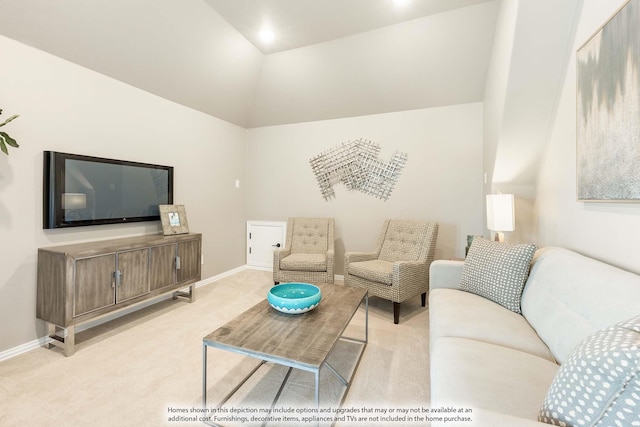 carpeted living area featuring lofted ceiling and baseboards