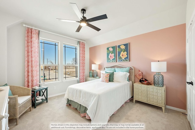 bedroom with baseboards, ceiling fan, and light colored carpet