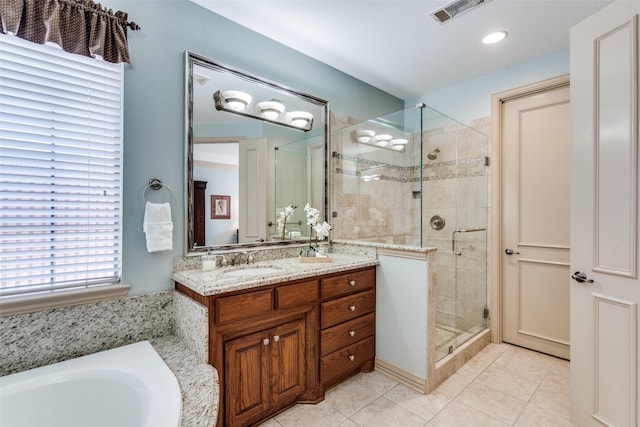 full bath featuring a stall shower, tile patterned flooring, visible vents, and vanity