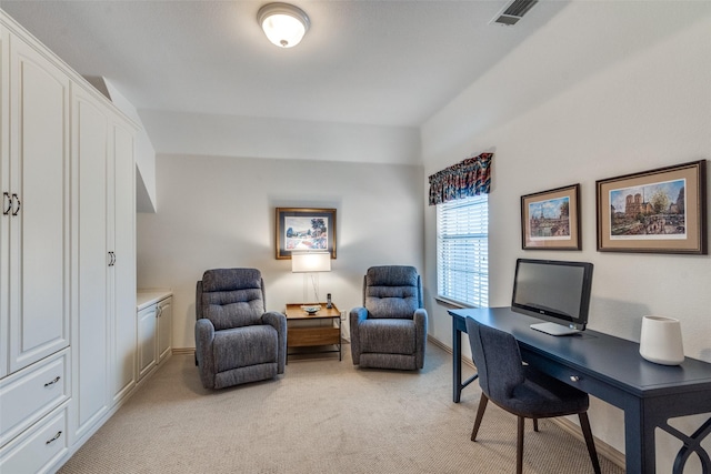 office space featuring light carpet, visible vents, and baseboards