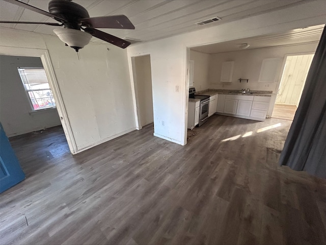 kitchen with visible vents, white cabinets, dark wood-style floors, ceiling fan, and stainless steel range with electric cooktop