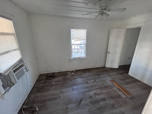 empty room with ceiling fan and wood finished floors