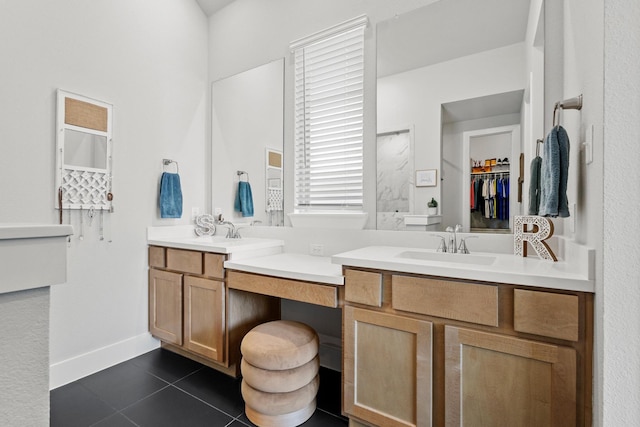 full bathroom featuring double vanity, tile patterned flooring, and a sink