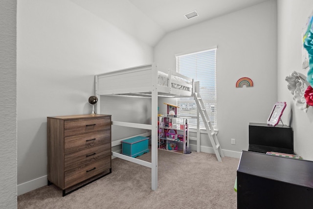 carpeted bedroom featuring lofted ceiling, multiple windows, visible vents, and baseboards