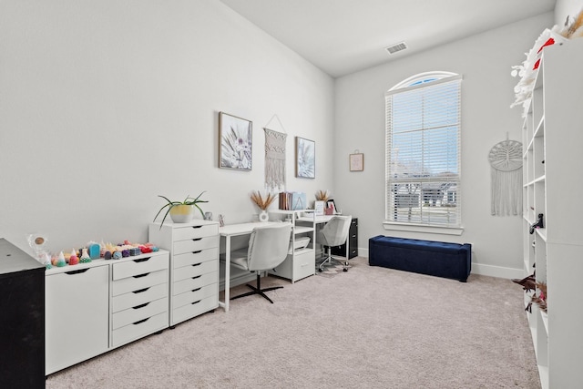 carpeted office featuring baseboards and visible vents