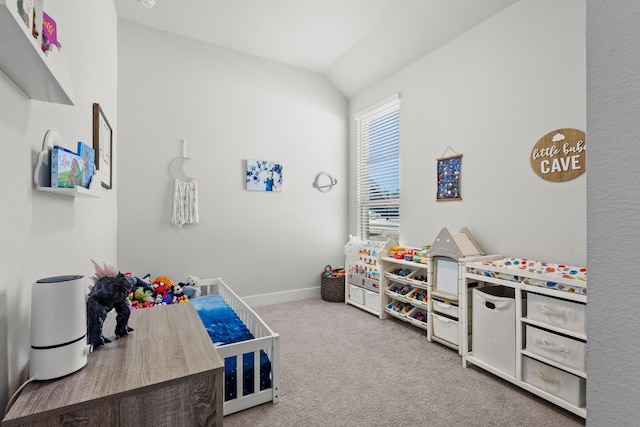 playroom featuring carpet, lofted ceiling, and baseboards