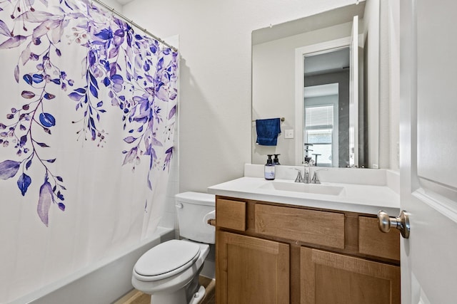 bathroom featuring shower / tub combo with curtain, vanity, and toilet