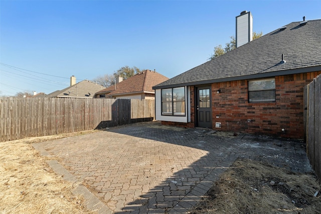 view of patio featuring fence