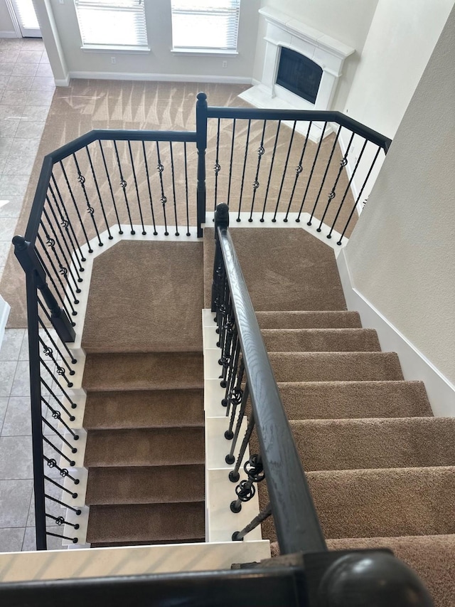 stairway with tile patterned flooring