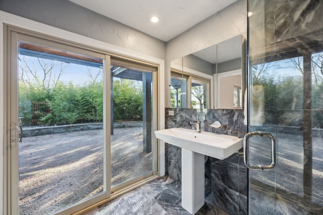 bathroom with marble finish floor