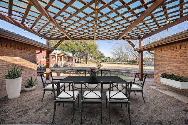 view of patio / terrace with outdoor dining space and a pergola