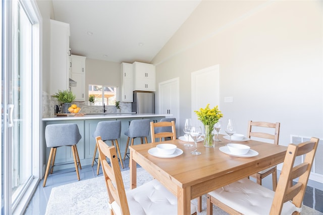 dining room featuring vaulted ceiling